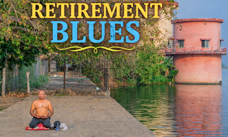 A man sits cross-legged in meditation on a concrete platform beside a calm water body, with trees and a cylindrical building reflected in the water.